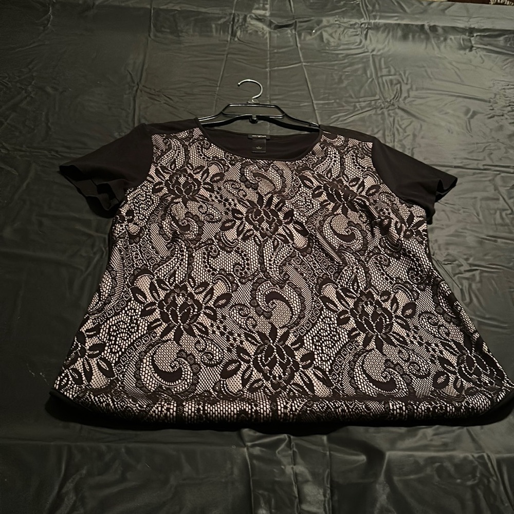 lace appliqué on front.  T shirt material on back. piped neckline & bottom
